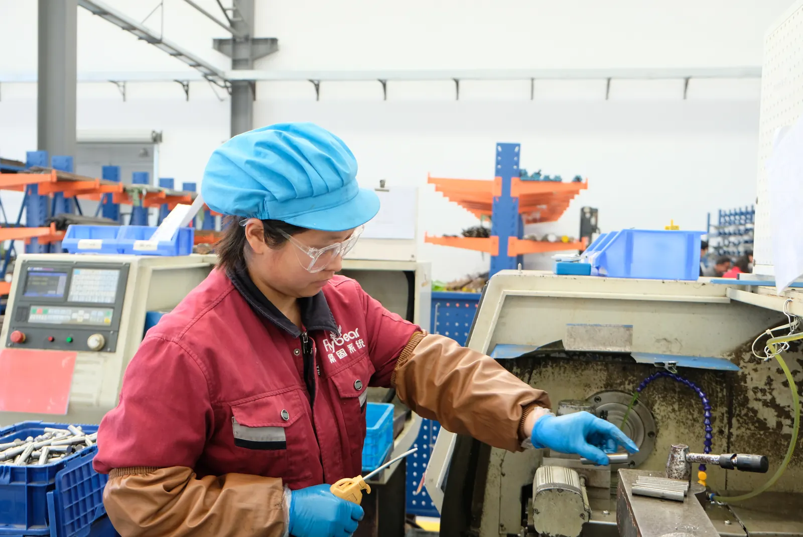 Flybear team member operating production equipment